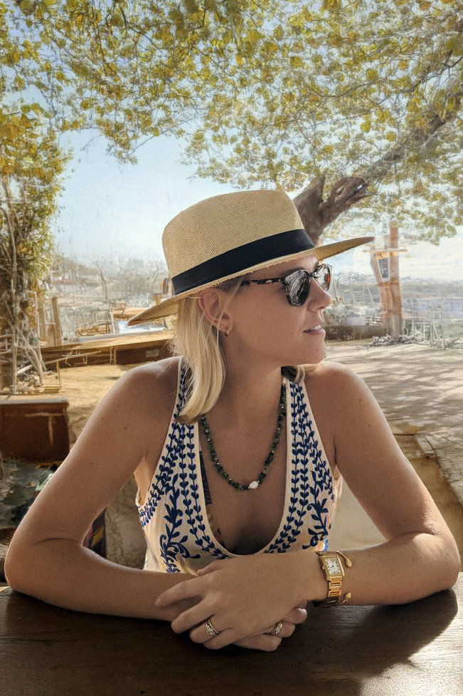 Lauren Nisbet standing next to a vehicle in an outdoor setting